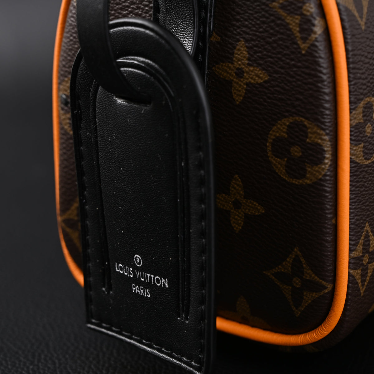 louis-vuitton-keepall-bandouliere-50-monogram-canvas-with-neon-orange-trim Handle